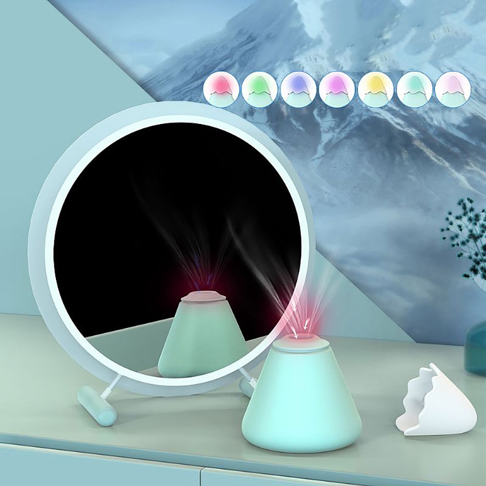 Vibrador Discreto em Silicone Recarregavel 7 Suc��es com LED Colorido Snow Mountain Cyan - Imagem ambiental mostrando o produto com reflexo e as opcoes de cores do LED RGB