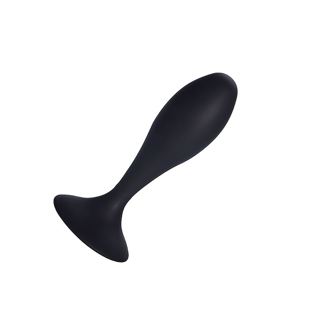 Plug anal de silicone preto em vista diagonal mostrando a curvatura suave e o toque aveludado do material