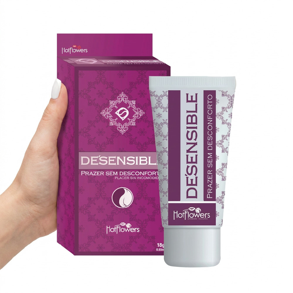 M�o segurando a caixa e o tubo do Gel Dessensibilizante De Sensible 18ml da Hot Flowers, dando ideia de tamanho