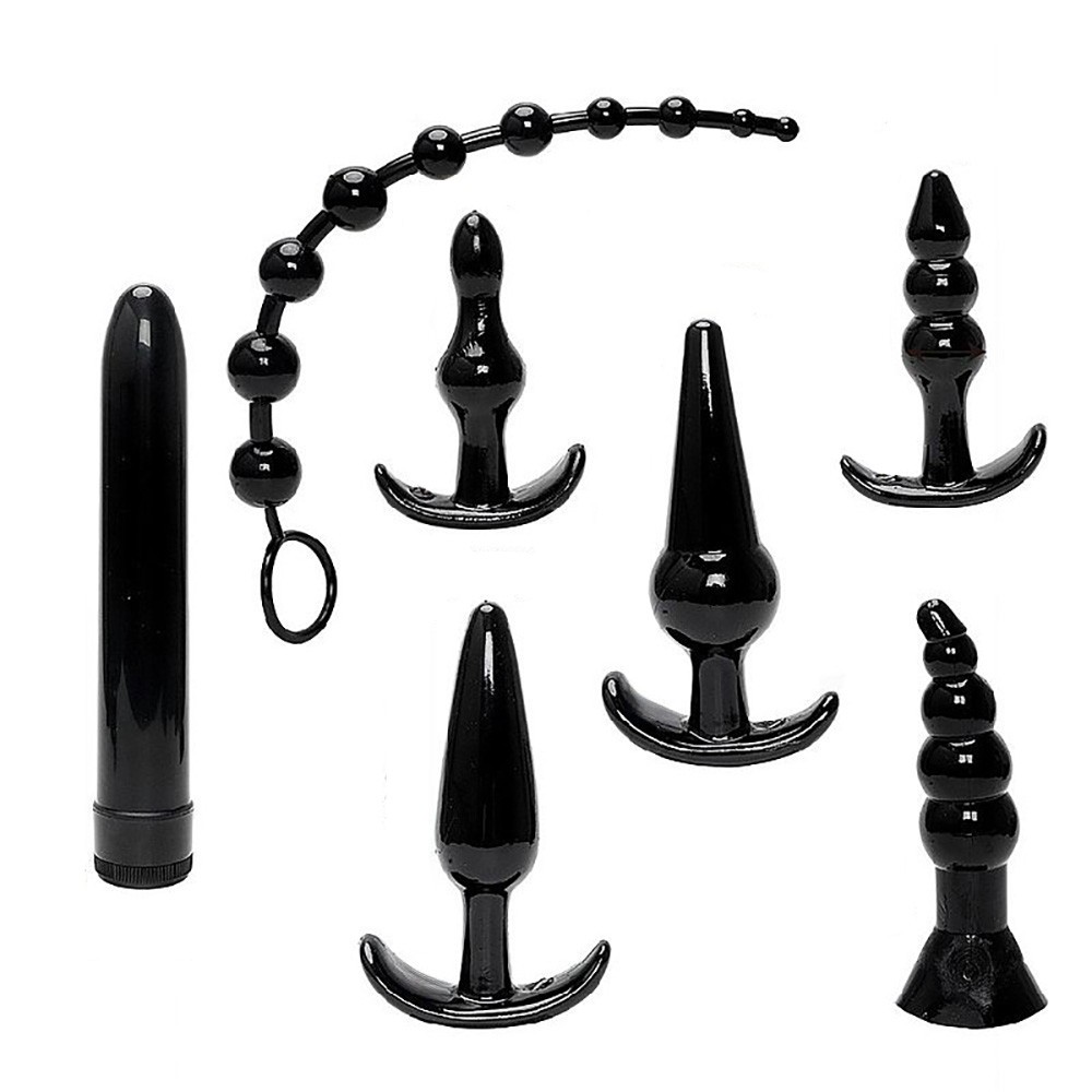 Vista superior do Kit Plug Anal com 6 plugs em diferentes formatos e o vibrador pessoal, real�ando a diversidade do conjunto