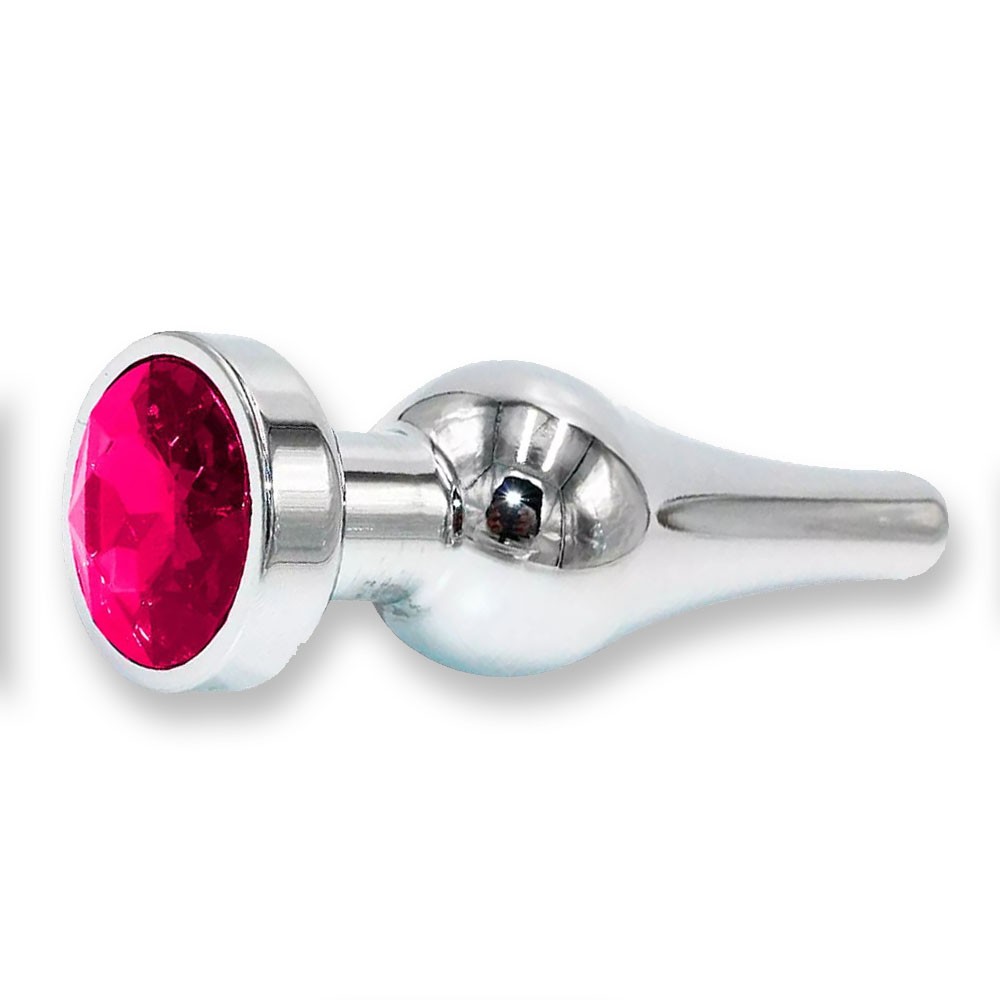imagem ambientada do plug anal joia em a�o inox com cristal pink destacando eleg�ncia e impacto visual