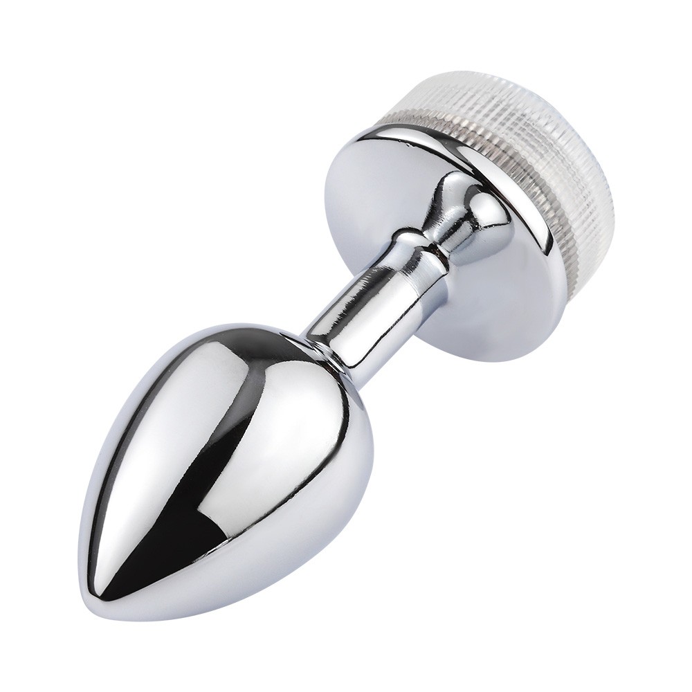 detalhe da base do plug anal joia em a�o com LED, mostrando a luz acesa e o design da joia