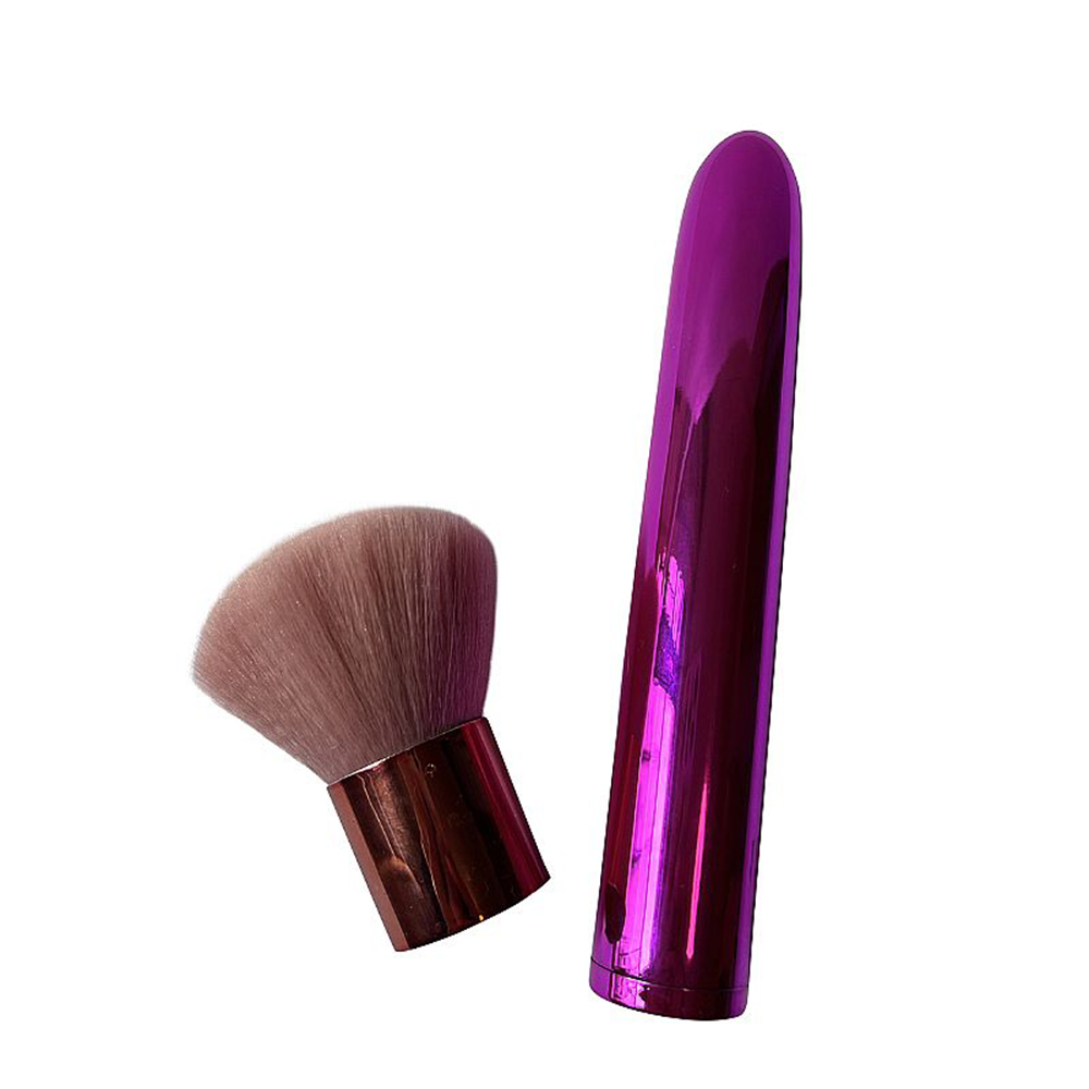 Vibrador Duplo Womanizer Roxo e o pincel de maquiagem separados, evidenciando a versatilidade do produto.