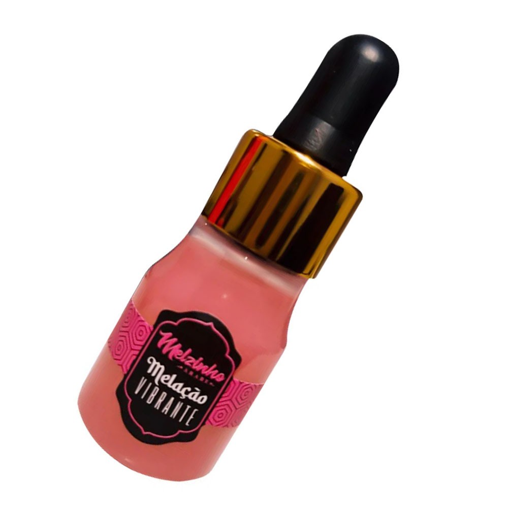 Frasco de �leo para Massagem Vibrante Aroma Chiclete Melzinho �rabe 15ml inclinado, mostrando o l�quido rosa