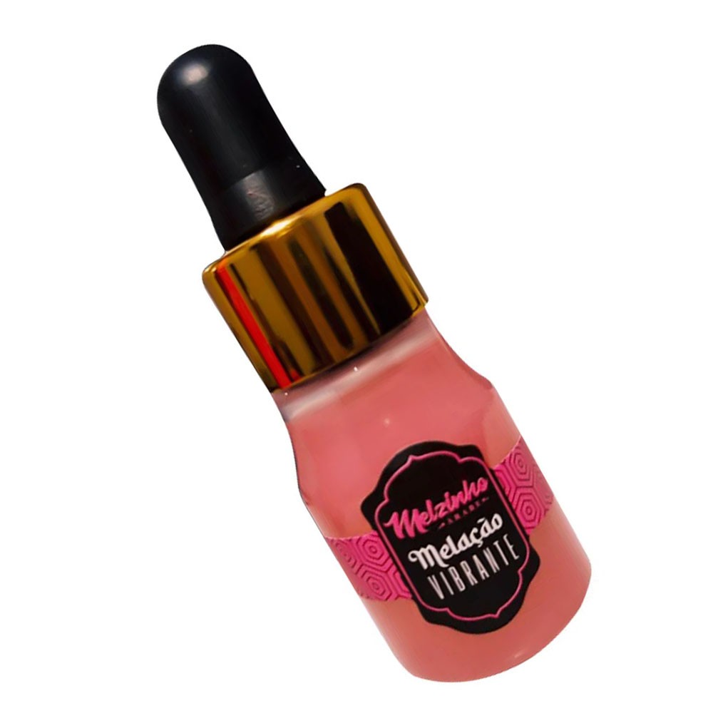 Detalhe do r�tulo e do l�quido do �leo para Massagem Vibrante Aroma Chiclete Melzinho �rabe 15ml