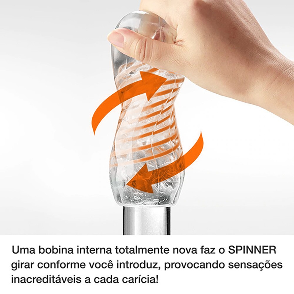 Close-up da m�o segurando o Tenga Spinner 05 Beads Vermelho, com setas indicando o movimento de rota��o interna ao introduzir e retirar