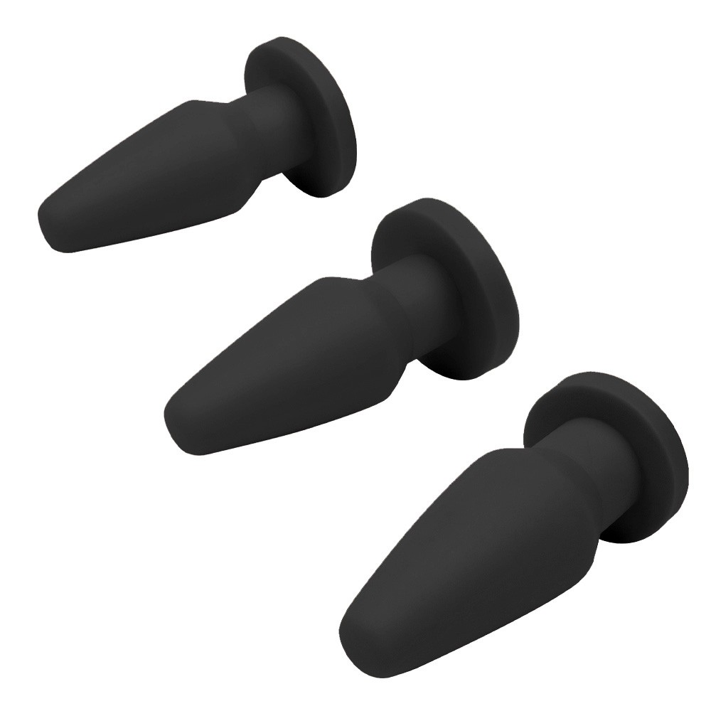 Kit Plug Anal Butt preto em PVC flex�vel de tr�s tamanhos diferentes, dispostos em fila decrescente
