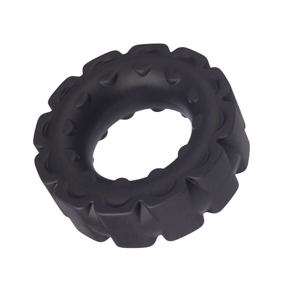 Anel Peniano em Silicone Dom A9 Preto em uma perspectiva lateral, real�ando suas estrias e a profundidade do anel
