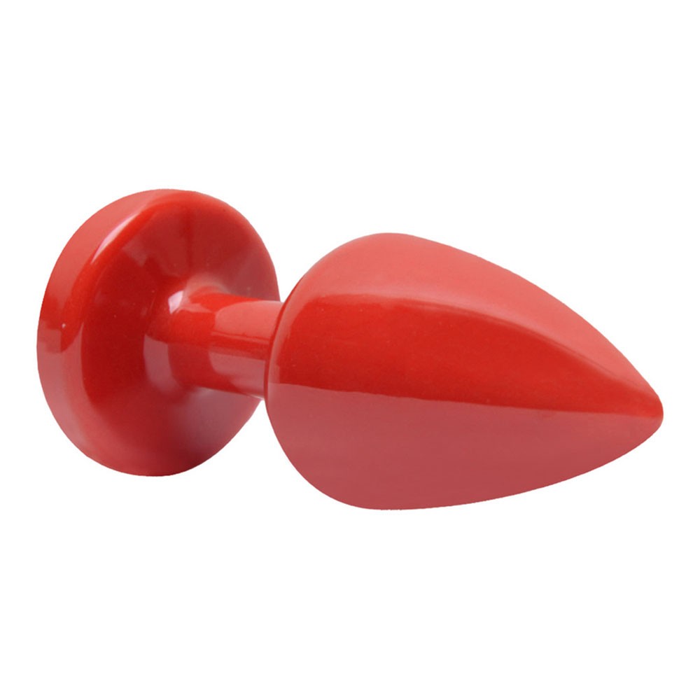 imagem ambientada do plug anal joia em ABS vermelho com pedra roxa destacando leveza e toque divertido