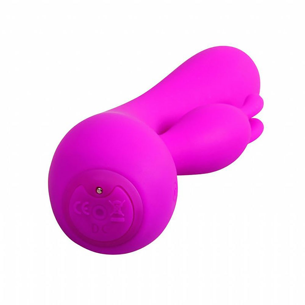 Vibrador duplo Stanley Pink em �ngulo, mostrando a porta de carregamento e selo de seguran�a na base