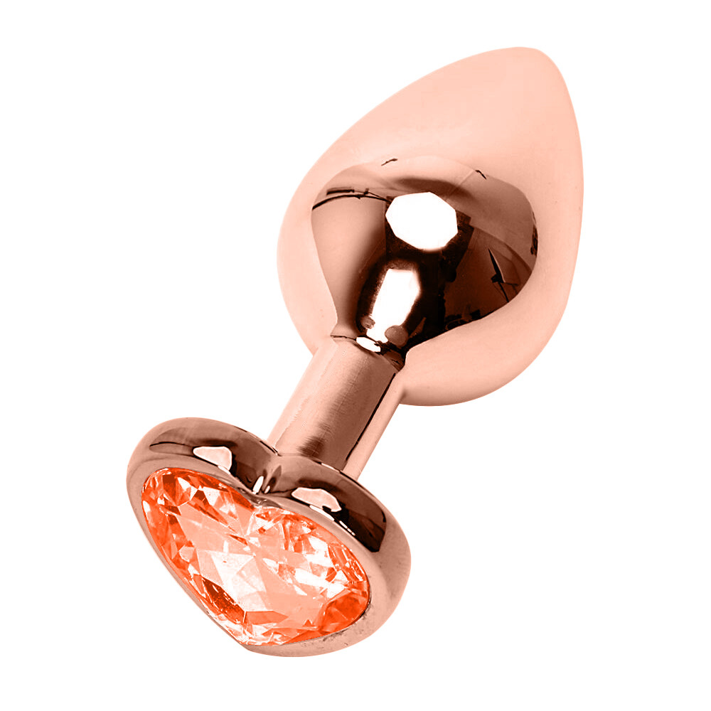 vista lateral do plug anal joia em a�o inoxid�vel rose com base de cora��o e cristal laranja evidenciando formato anat�mico e brilho