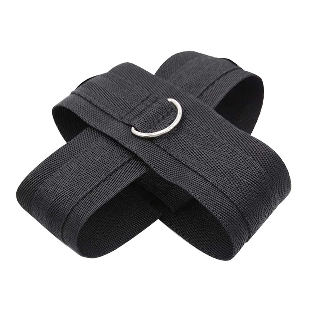 Algema Cruzada em Neoprene preta em close-up, evidenciando a textura do tecido e a argola met�lica
