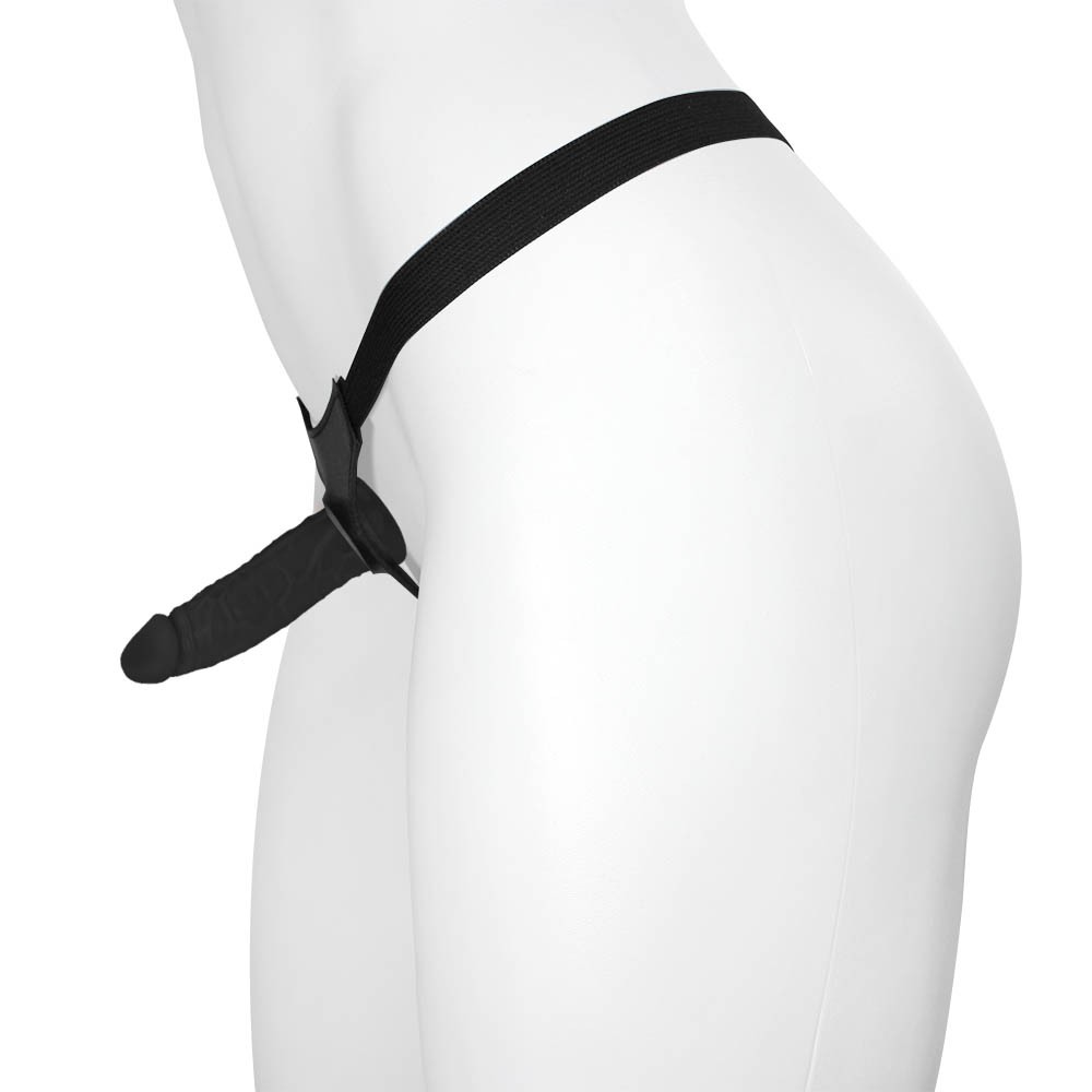Vista lateral da cinta peniana com p�nis real�stico preto em manequim branco