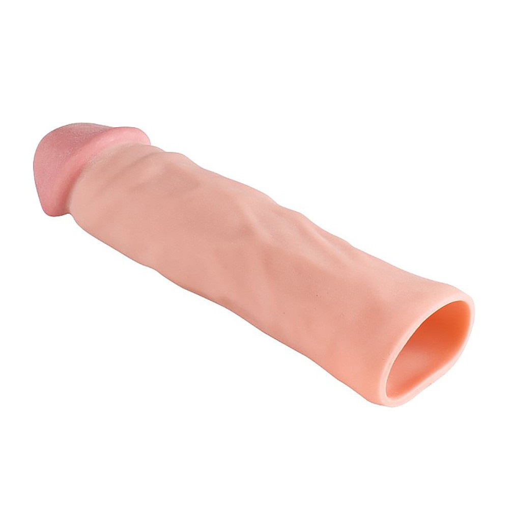 Close da textura da capa peniana em Cyberskin, real�ando a maciez e o realismo do material bege
