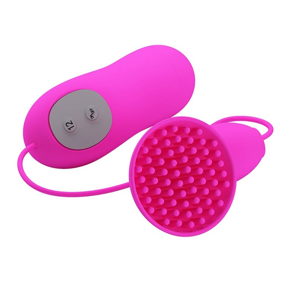 Vibrador para Clit�ris Brady Pink, em vista superior, com a cabe�a de cerdas evidenciando sua textura e o controle com fio ao lado do vibrador principal