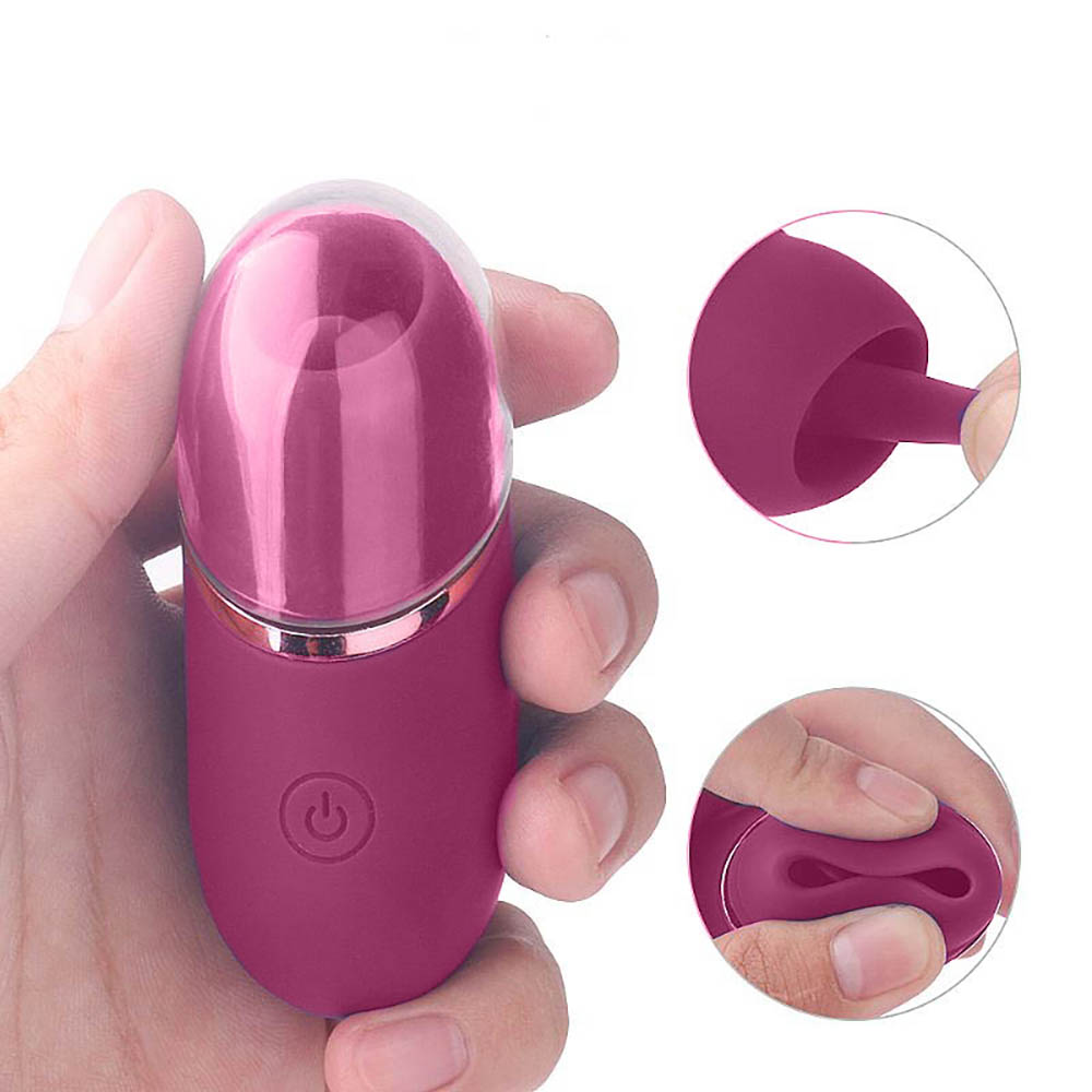 Vibrador para clit�ris recarreg�vel em silicone roxo held up na m�o, com detalhes da ponta e da flexibilidade do material