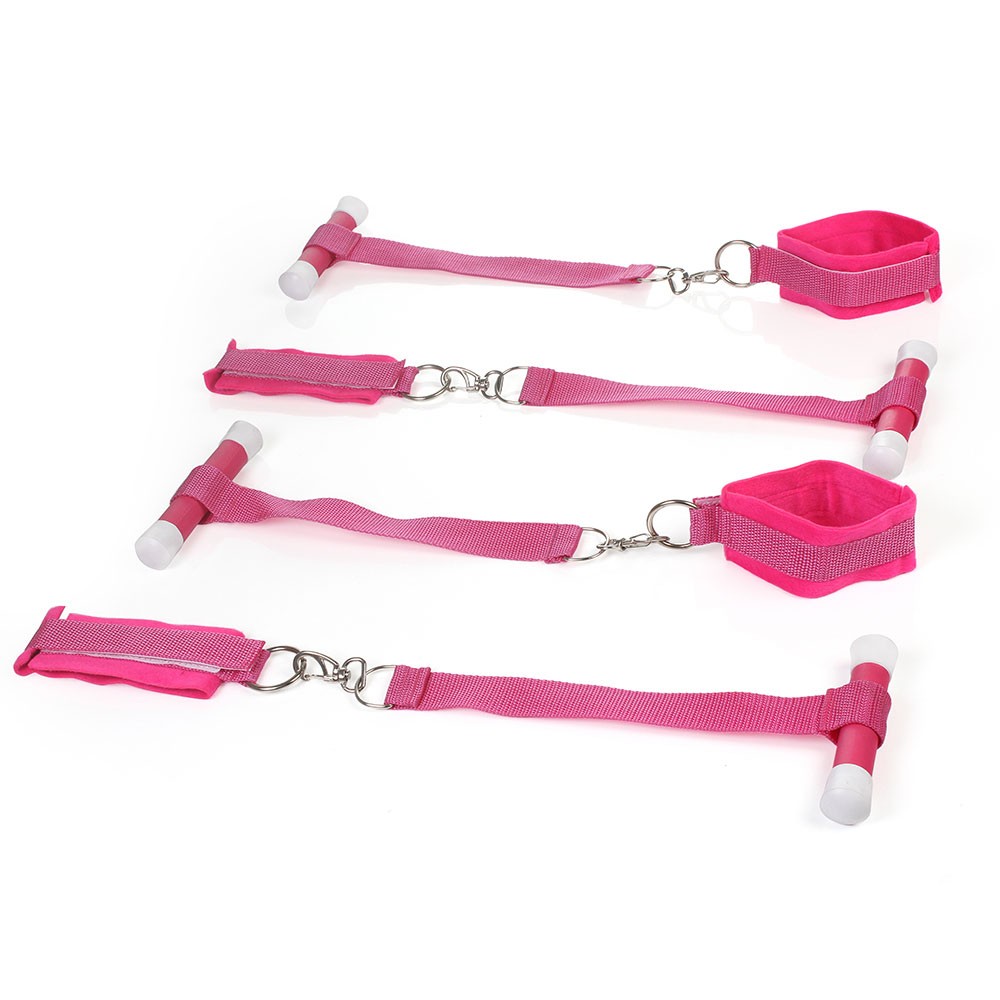 Detalhe das quatro amarras rosa do Kit Bondage, mostrando punhos ajust�veis, ganchos e suportes de fixa��o em formato de T