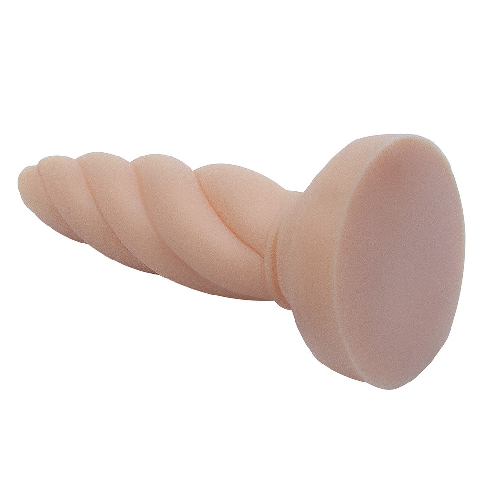 Plug anal Twister Bege em PVC flex�vel deitado, com foco na ponta e corpo alongado
