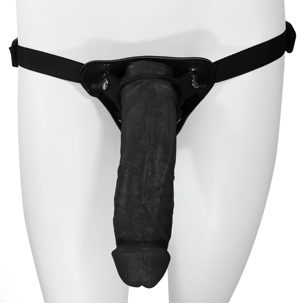 Cinta peniana King Kong preta ajust�vel com p�nis real�stico, vista frontal em manequim branco