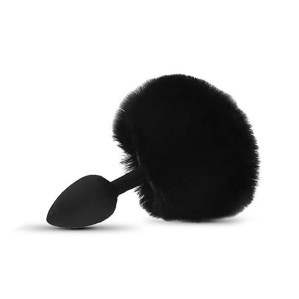 Plug anal de silicone preto com cauda de coelho macia e peluda em vista lateral