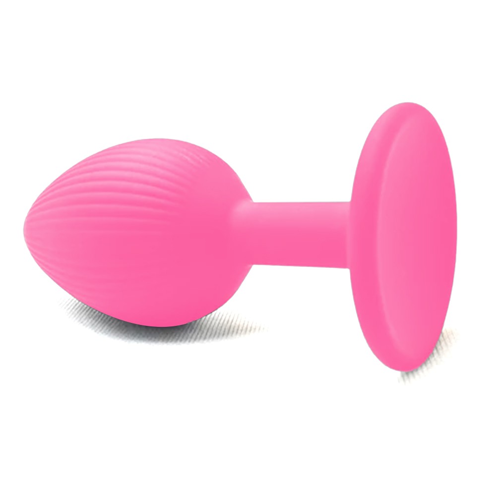 Plug Anal em Silicone Pink, vista de cima com destaque para o corpo estriado e a base da ventosa