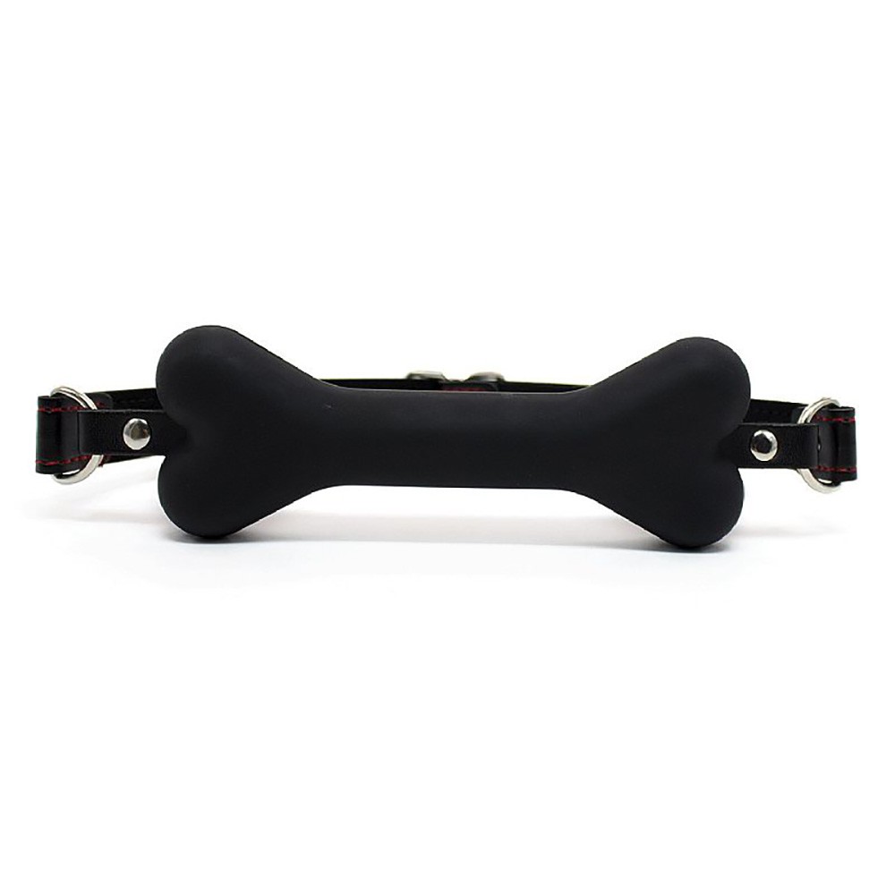 Morda�a com formato de osso em silicone aveludado preta, vista frontal com o bocal e a fivela ajust�vel em PU