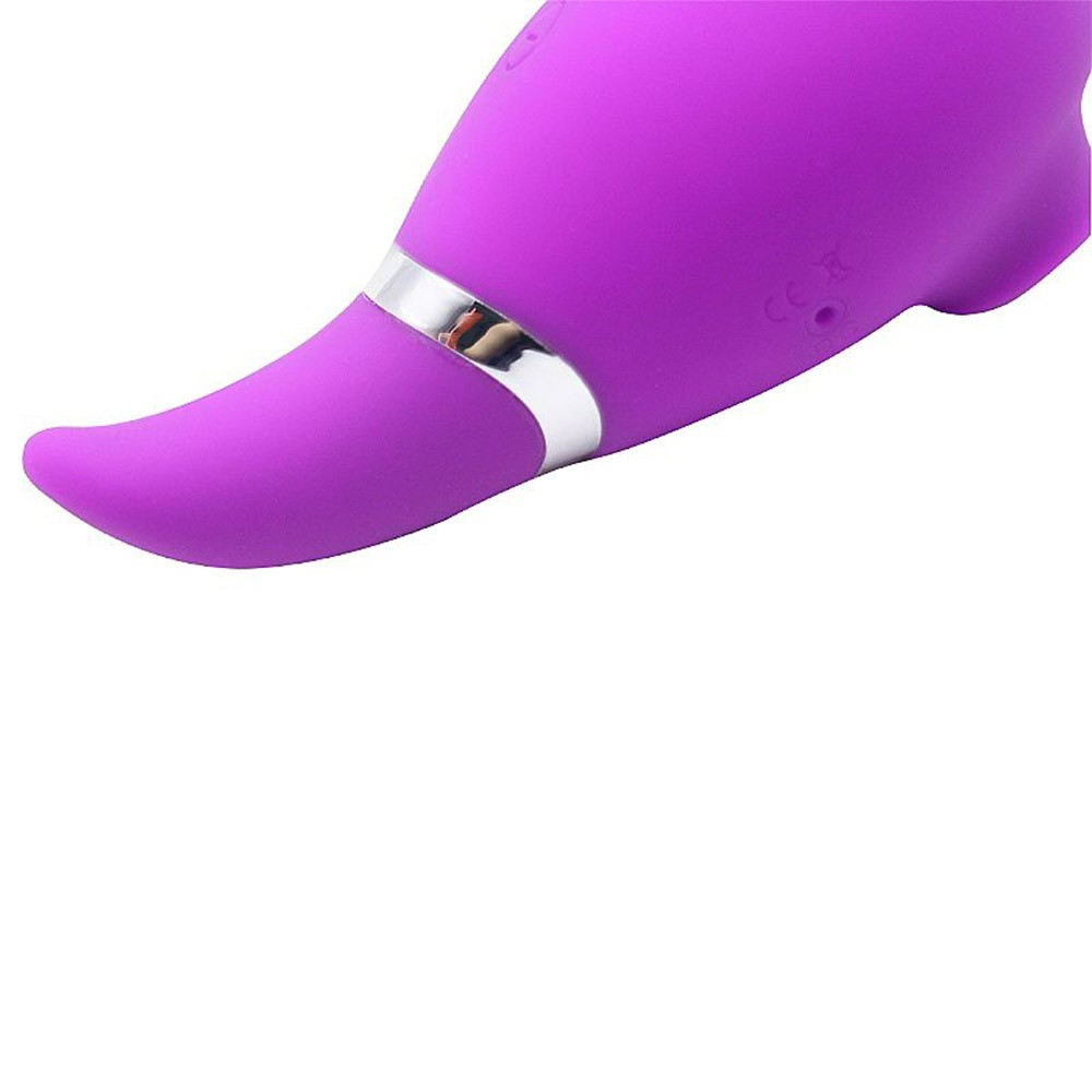Vibrador para Clit�ris Zaki Pink em ambiente intimista, destacando seu design elegante e cor vibrante