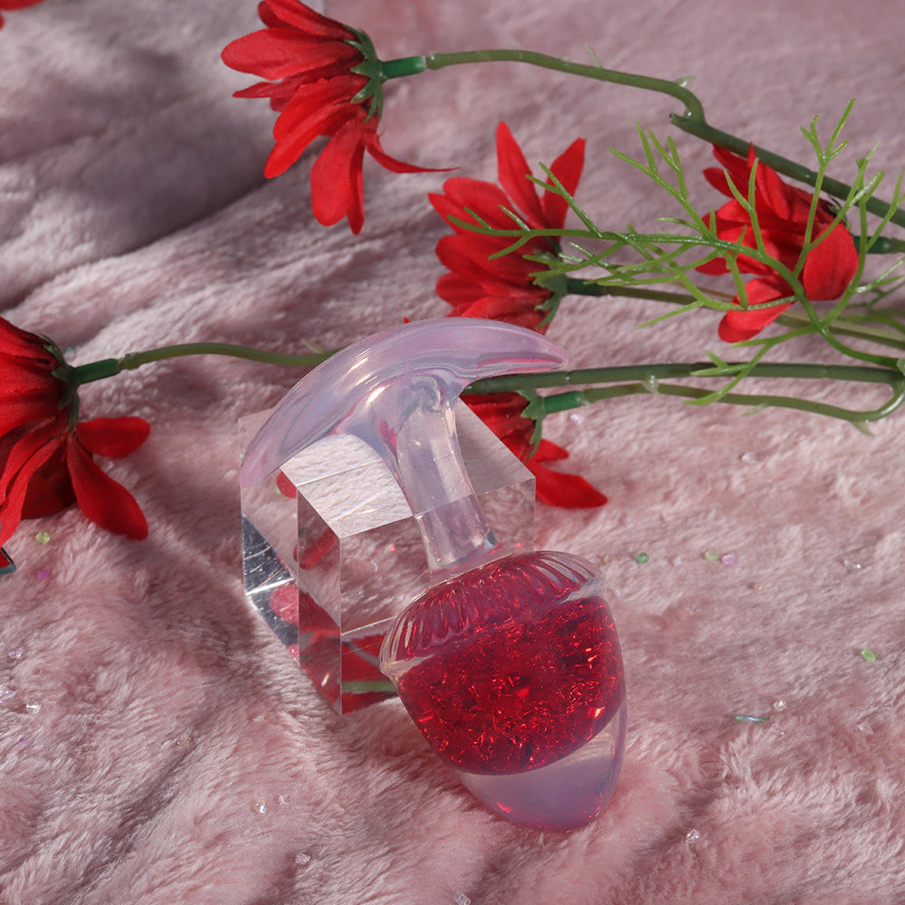 Plug Anal em Silicone Vermelho, detalhe da al�a de seguran�a transl�cida com a esfera de vidro vermelha interna